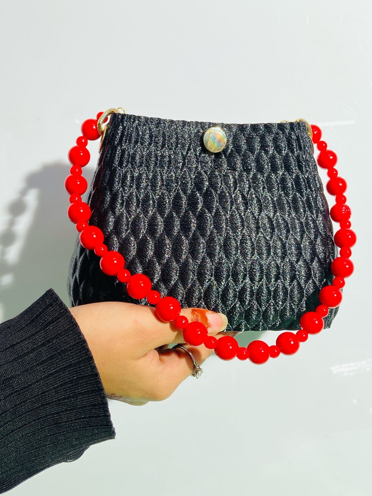 3D-Printed Black Textured Handbag with Bold Red Beaded Handle