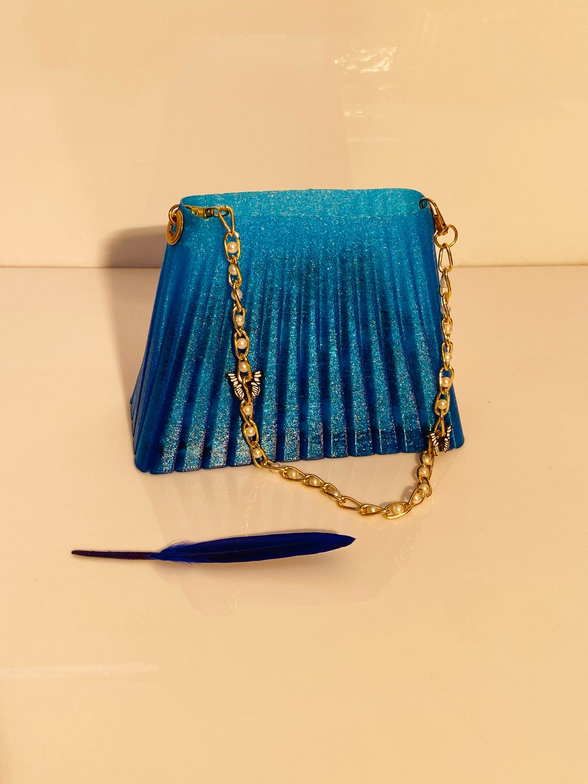 3D-Printed Blue Pleated Handbag with Golden Chain