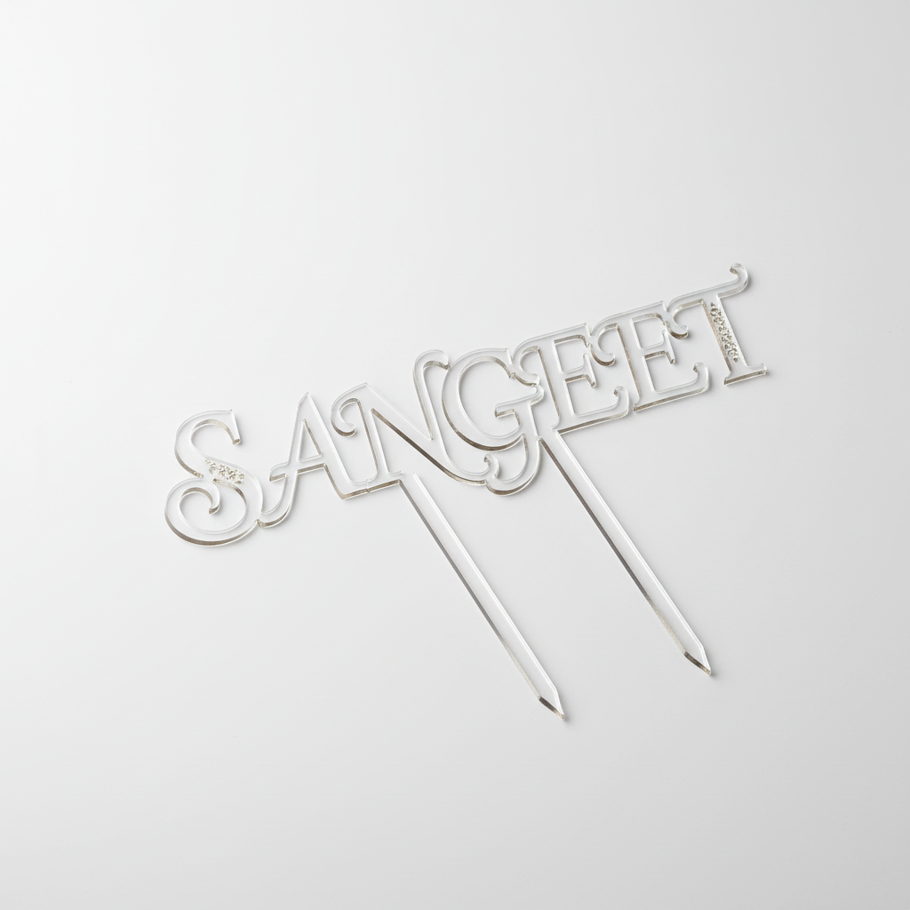 Close-up of Sangeet cake topper showing intricate lettering design