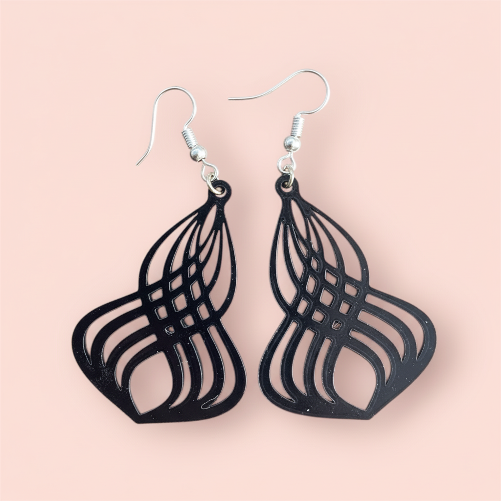 Close-up wavy cutout earrings intricate 3D printed wave pattern