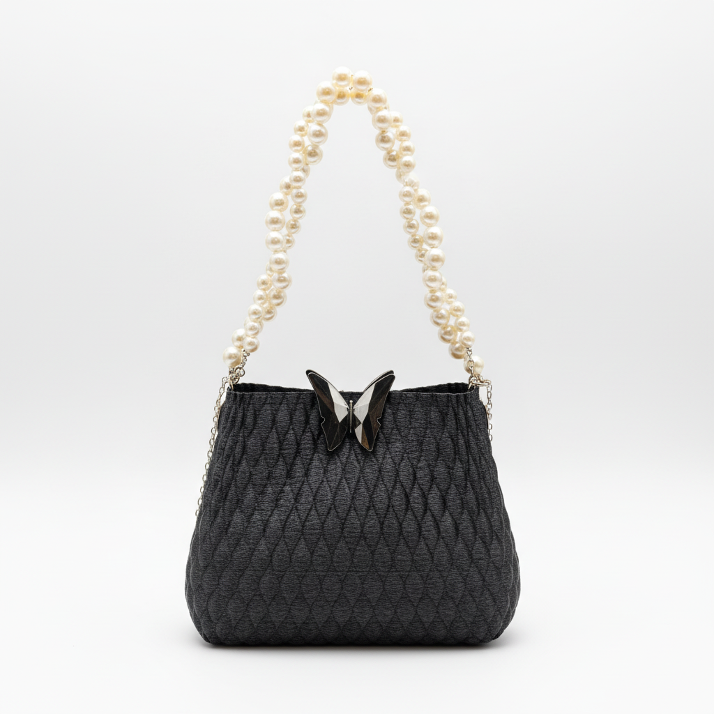Close-up of butterfly black pearl charm bag showing textured 3D printed design