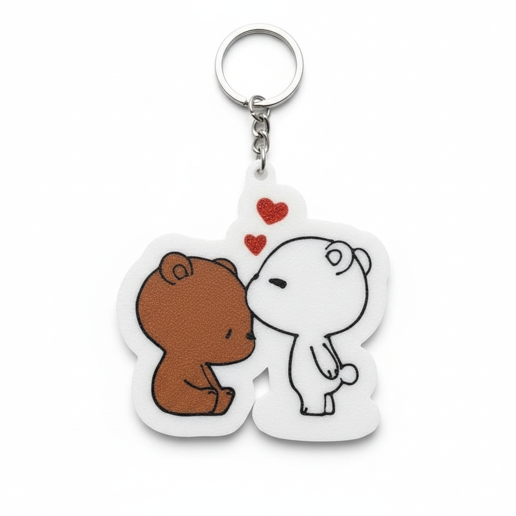 Close-up of 2D printed Dudu Bubu keychain showing cute couple character design