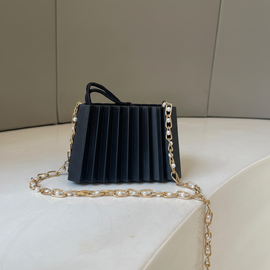 Close-up black pleated mini handbag 3D printed pattern eco-friendly