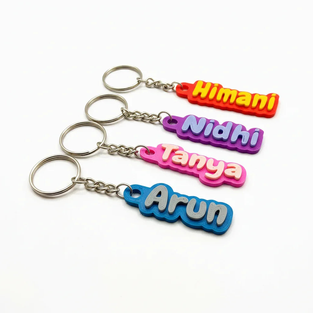 Colorful custom name keychains by The Sculpt Studio on white background