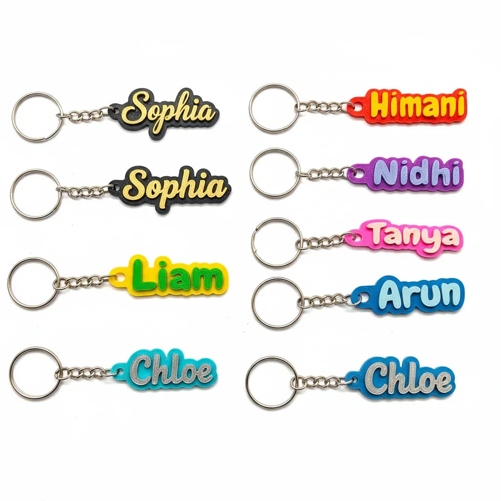Custom name keychains in various colors with names Sophia, Himani, Nidhi, Tanya, Liam, Arun, Chloe from The Sculpt Studio